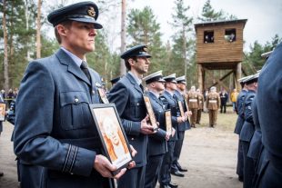 Royal Air Force personnel parading at the site of the Great Escape