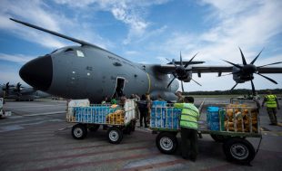 An RAF A400M aircraft is loaded with aid