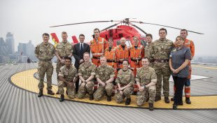 Defence Secretary Gavin Williamson stands alongside staff on the helipad at the Royal London Hospital and London’s Air Ambulance at Barts Health NHS Trust. Crown Copyright.