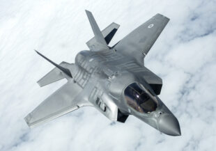 An RAF F-35B Lightning aircraft above clouds.