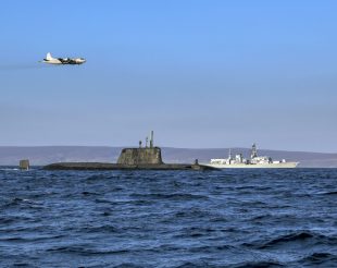 An Astute class nuclear submarine, the Type 23 frigate HMS Kent and a German Navy P3 maritime patrol aircraft at sea.