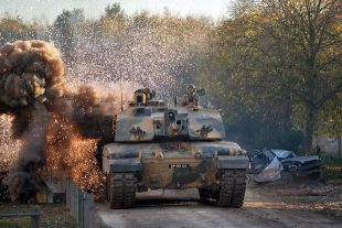 A tank crossing a bridge