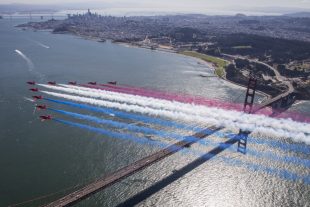 The Royal Air Force Aerobatic Team, The Red Arrows flypast the Golden Gate Bridge, San Francisco, yesterday, trailing the Red, White and blue smoke over the bridge.